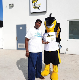 A Kool Runnings Ice team member with the company mascot